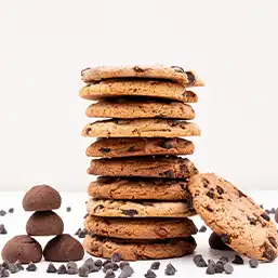 A tall stack of freshly baked chocolate chip cookies