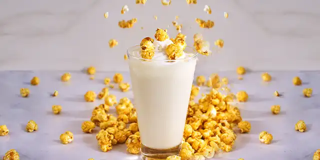 A milk-based frappe with hints of white chocolate, topped with caramel popcorn