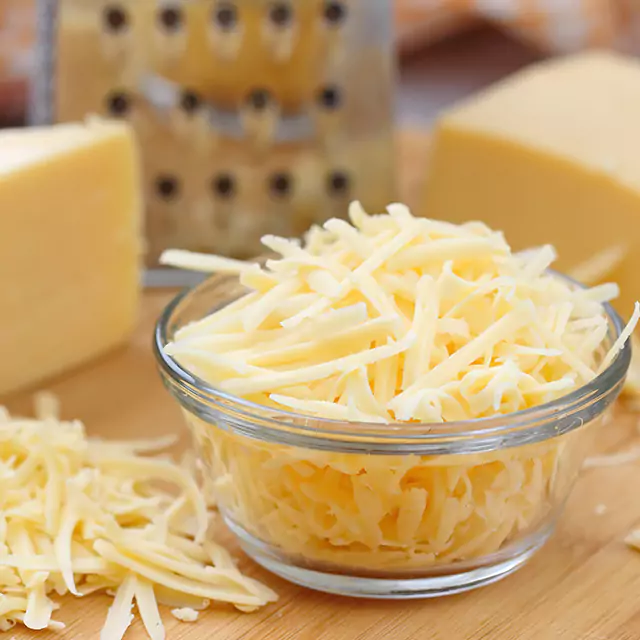 Close up shot of grated analogue cheese